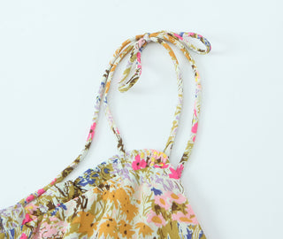 Floral bikini top with colorful straps on a white background