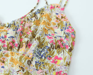 Floral patterned dress with colorful design on a white background