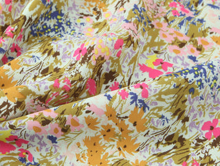 Floral fabric with pink, yellow, and brown colors.